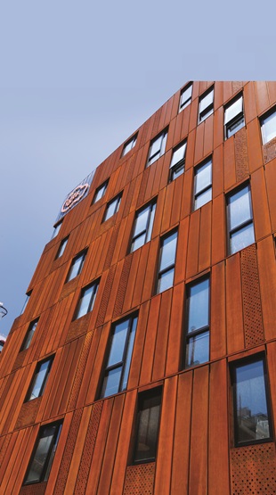 The perforated weathering steel cladding was key to balancing the need for light, space and privacy